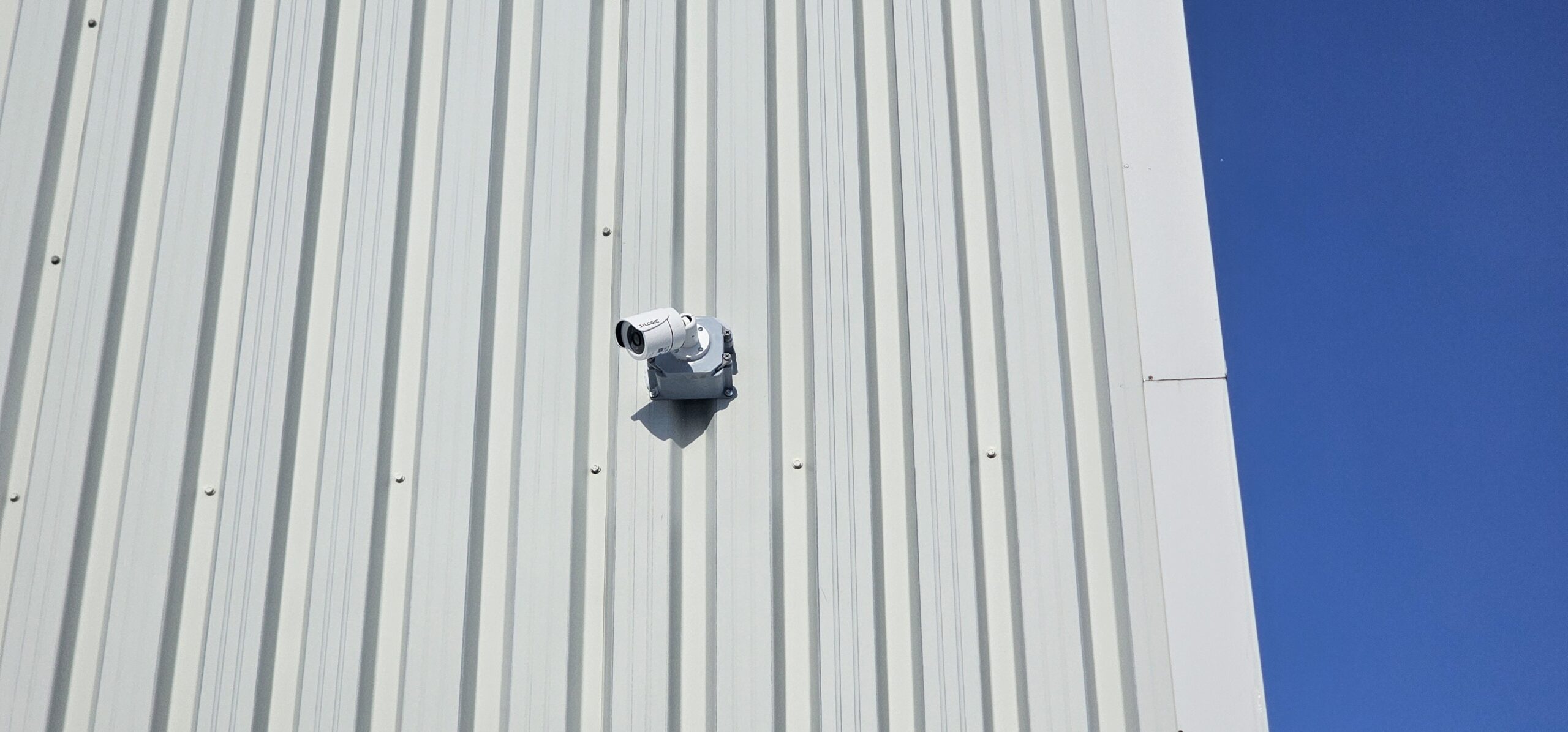 Dome security camera installed on an exterior wall