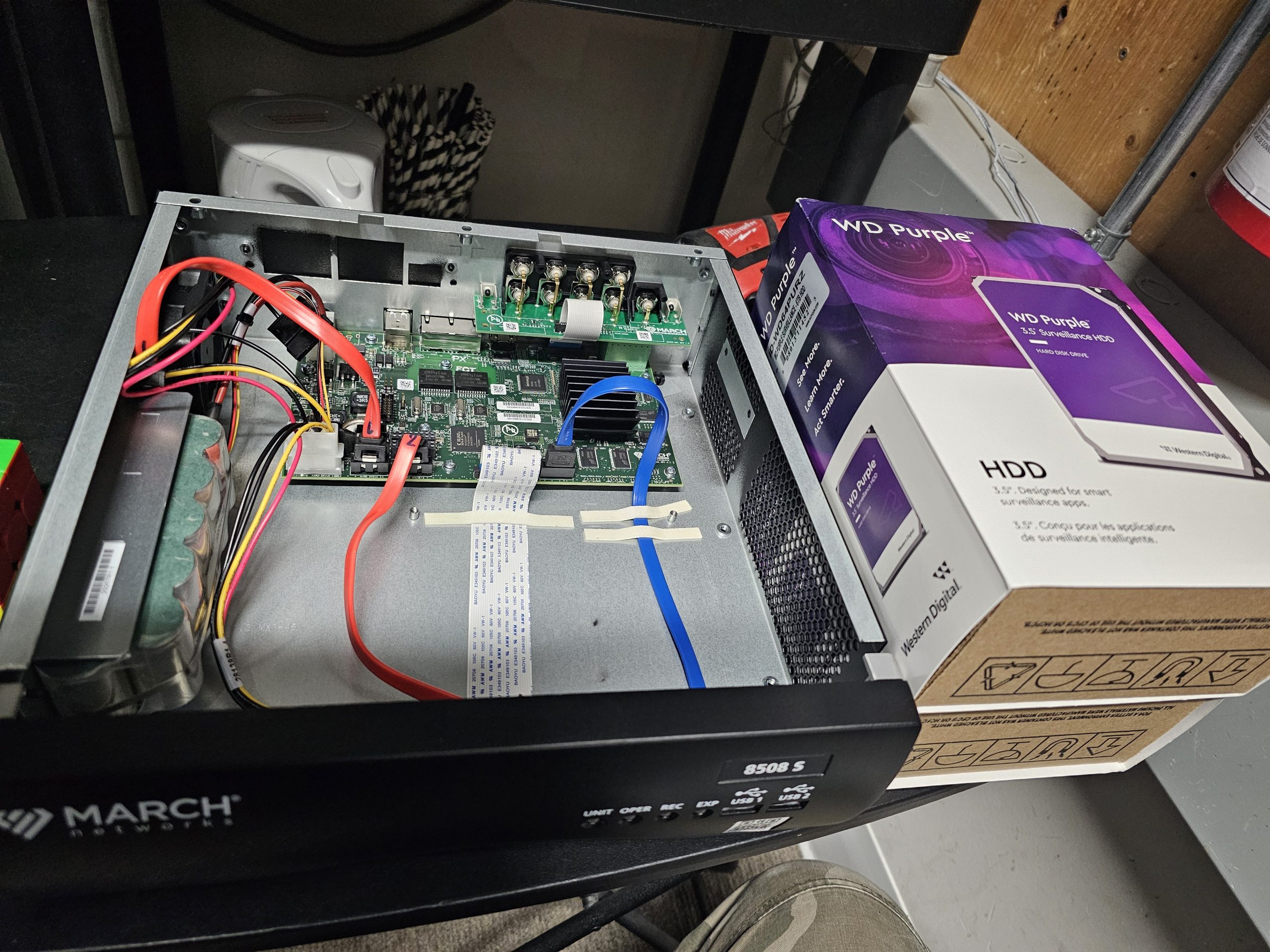 Open security control panel showing internal wiring