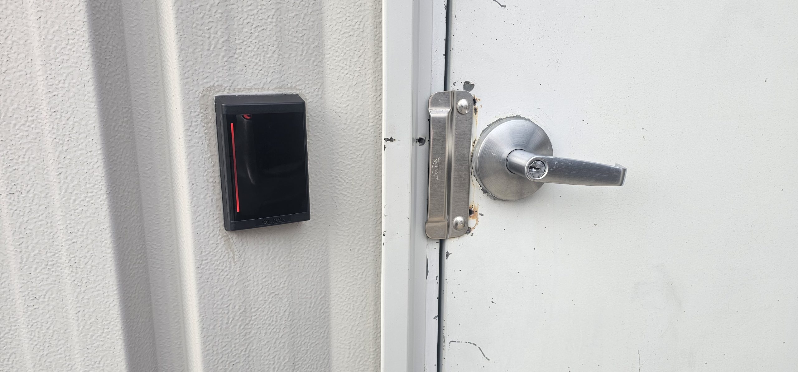 Access-control card reader beside a secured door