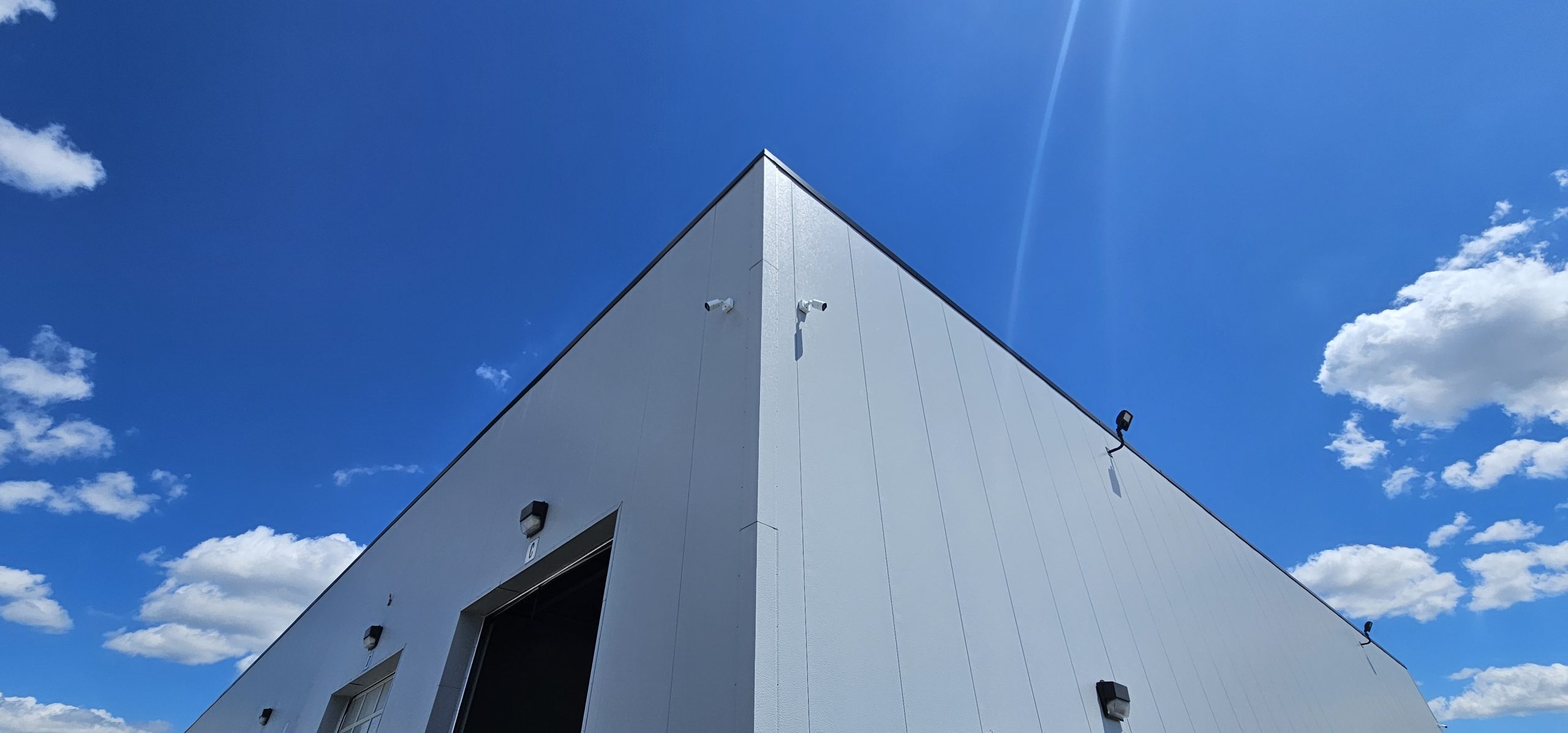 Commercial building exterior under a blue sky